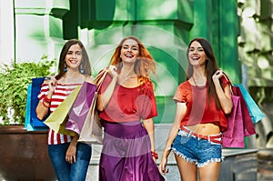 Three pretty sisters with Shopping Bags