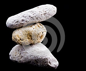 Three Pumice stones on black