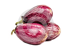 Three purple eggplants