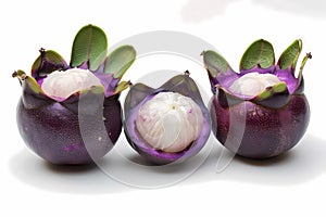 Three purple mangostissa fruit, one of which is cut in half and placed on the white background. Ai generated