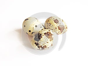 three quail eggs