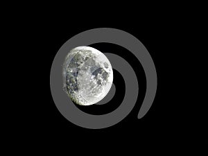 Three quarter moon on the night sky