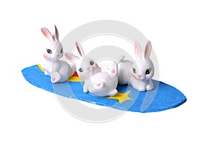 Three rabbits and surfboard.