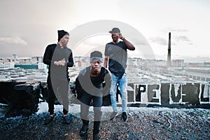 Three rap singers band on the roof