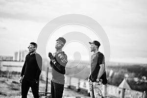 Three rap singers band on the roof