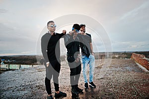 Three rap singers band on the roof