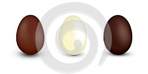 Three realistic Easter Chocolate Eggs isolated on white.