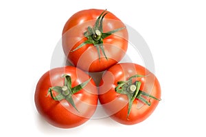 Three realistic looking tomatoes lying in a triangle isolated in white background
