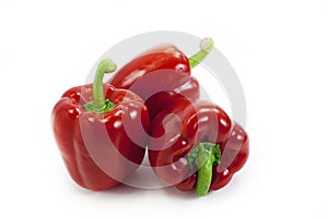 Three red bell peppers