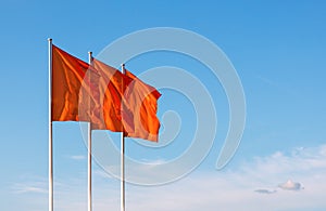 Three red blank flags waving in the wind