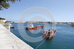 Three red boats in Valletta harbour, Malta