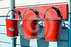 Three red buckets