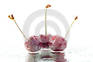 Three red cherries