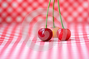 Three red cherries