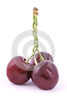 Three red cherries