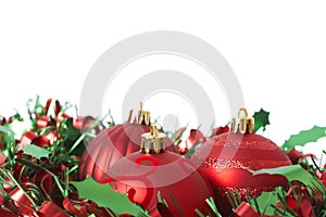 Three Red Christmas baubles on tinsel