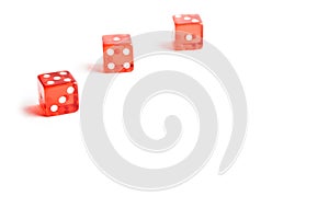 Three red dice in a corner on white background