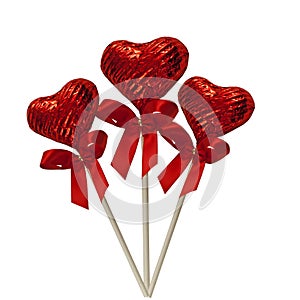 Three red foiled chocolate hearts