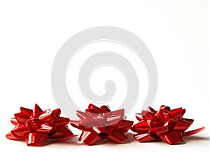 Three red gift bows