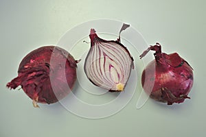 Three Red Onions on a simple background