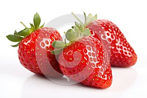 Three red ripe fresh strawberries with strawberry leaves on isolated white background. Organic farm food, fresh market.