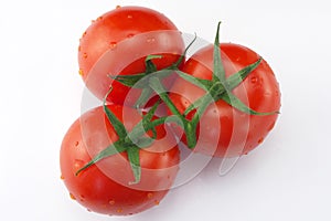 Three red ripe tomatoes
