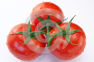 Three red ripe tomatoes