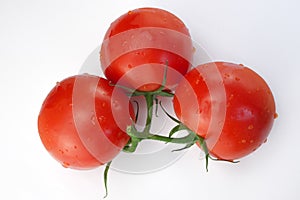 Three red ripe tomatoes