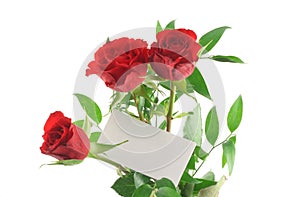 Three red roses with blank love note