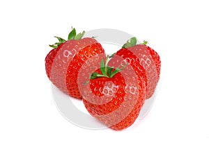 Three red strawberries isolated on a white background. Organic strawberry.Healthy food. Fresh strawberry