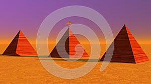 Three red striated pyramids in desert