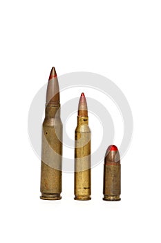 Three red-tipped tracer cartridges isolated photo