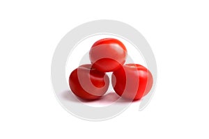 three red tomatoes on the white background