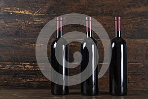 Three red wine bottle