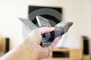 Three remote controls in one hand