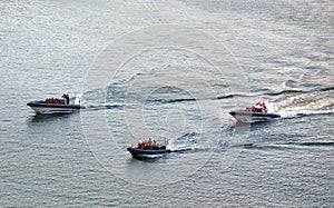 Three rescue boats at sea