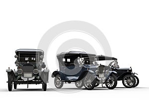 Three restored vintage cars side by side