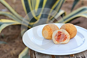 Three rice dumplings filled with minced meat sauce, called Sicilian