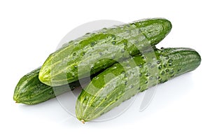Three ripe green cucumber in stack isolated on white background
