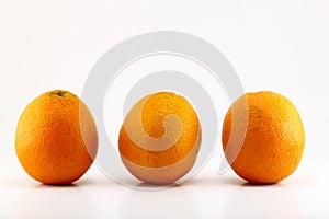 Three ripe oranges isolated on white background