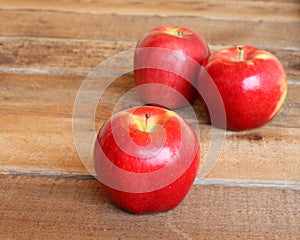 Three ripe red apples