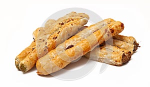 Three rollinis with different fillings on a white background