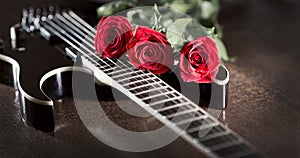 Three roses on black guitar