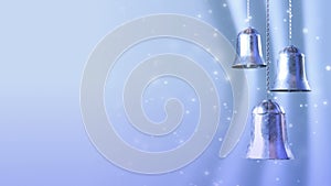 Three rotating blue silver christmas bells with glitter bokeh background. Seamless loop. 3D render