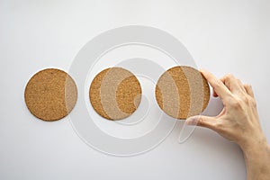 three round cork board and hand selecting the right