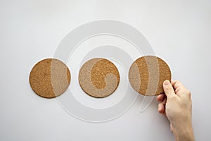 three round cork board and hand selecting the right