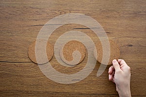 three round cork board and hand selecting