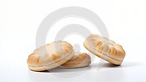 Three round, golden, sandwich biscuits on white background
