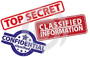 Three rubber stamps top secret, confidential, classified information