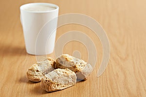 Three rusks with a mug of coffee